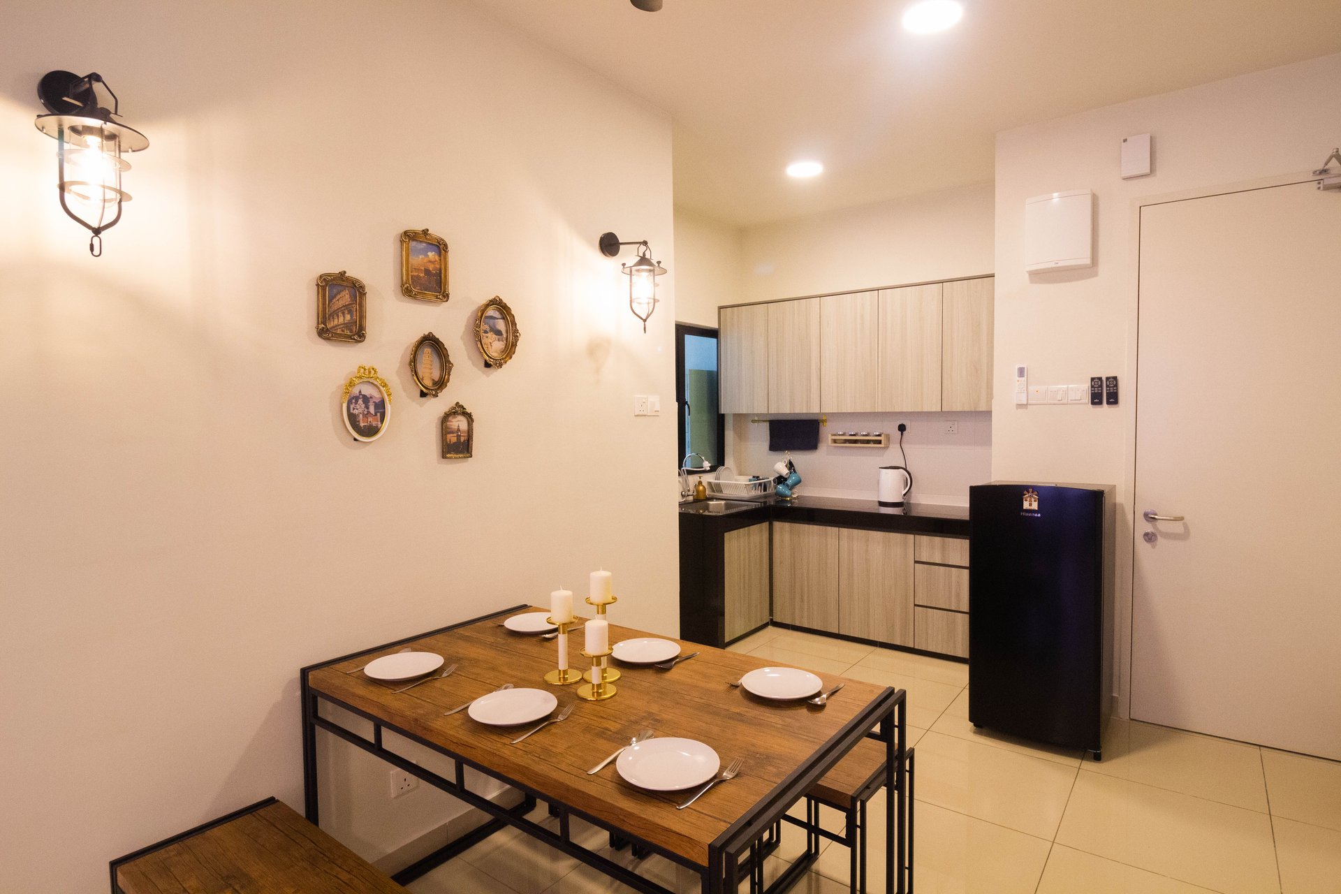 Dining table and kitchen area at One Maxim Sentul